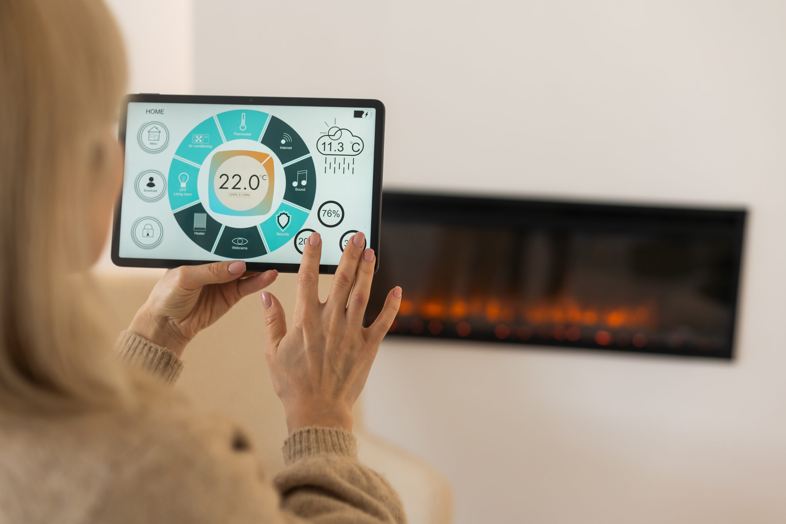 holding digital tablet in cozy living room with fi 2025 01 08 11 37 09 utc scaled