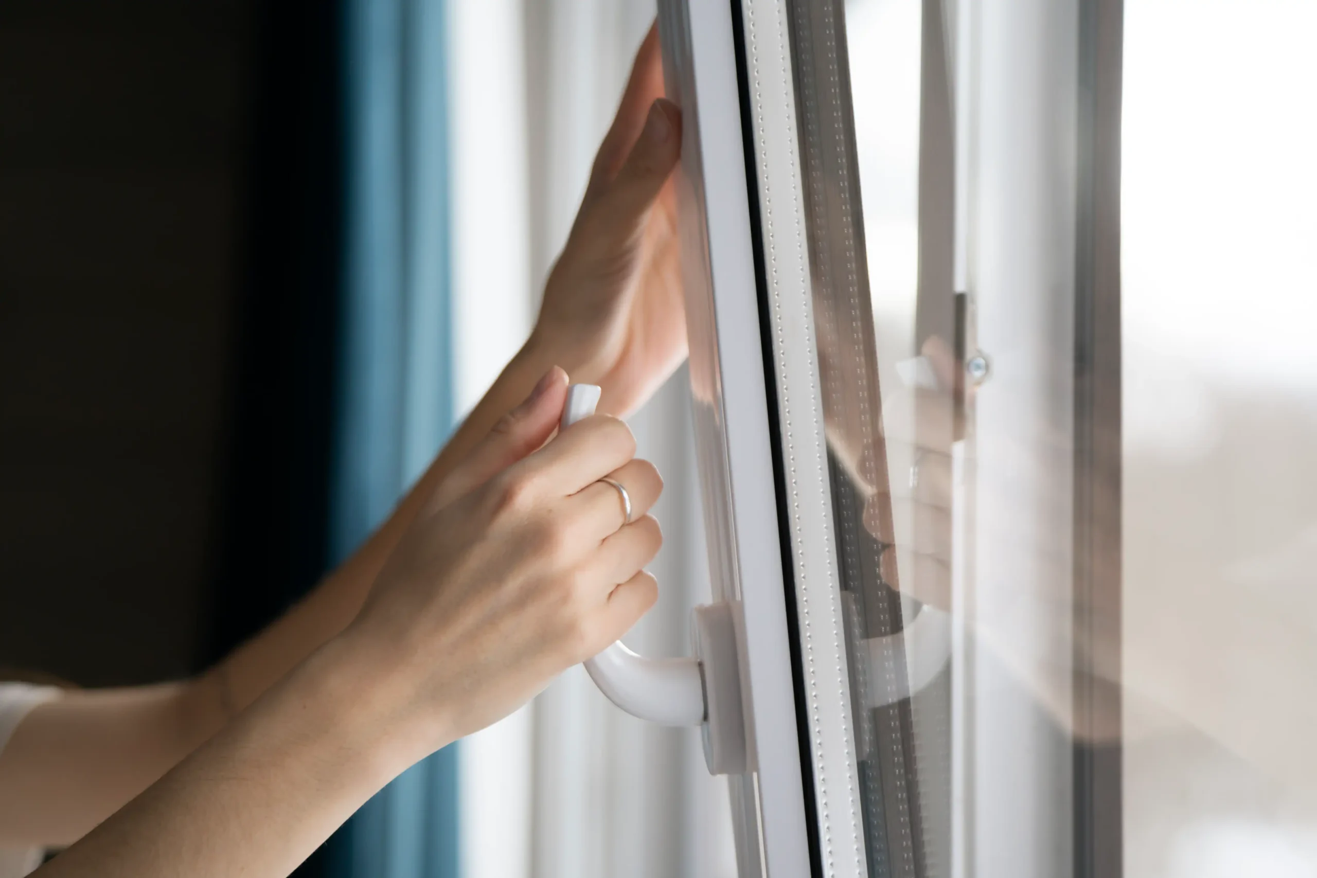 person opening window for fresh air indoors 2026 03 17 03 34 57 utc scaled